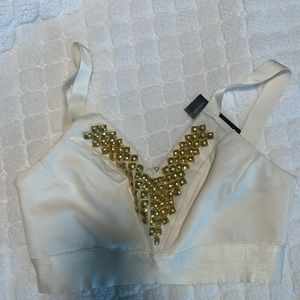 White Bebe top with gold accents